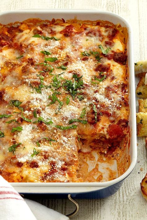 This lasagna recipe is a Better Homes & Gardens favorite. Our classic lasagna recipe features your choice of ricotta or cottage cheese, plus mozzarella and Parmesan for all that cheesy goodness. Don't forget the garlic bread! #recipes #recipeideas #dinnerrecipes #dinnerideas #familydinner #bhg Garden Lasagna, Healthy Comfort Food Dinners, Classic Lasagna Recipe, Soft Foods Diet, Cheese Pull, Sausage Lasagna, Classic Lasagna, Cottage Cheese Recipes, Comfort Food Recipes Dinners