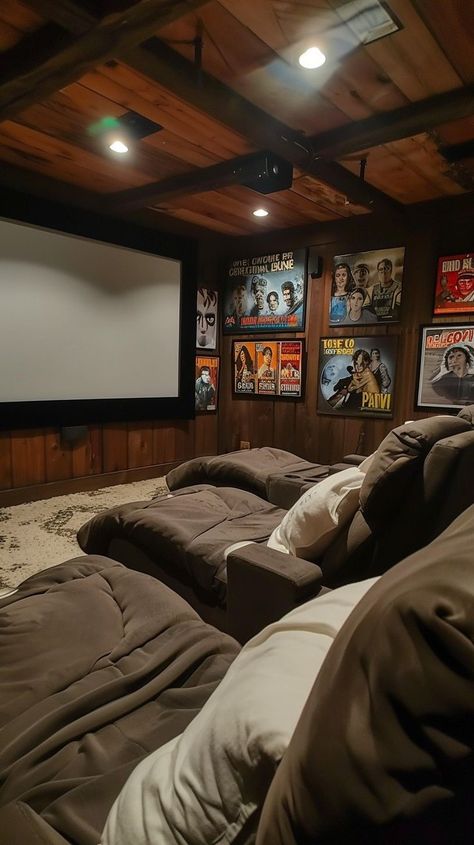 Rustic home theater with plush seating, wooden paneling, and classic movie posters for immersive viewing experience Wooden Paneling, Home Cinema Room, Classic Movie Posters, Cinema Room, Inviting Home, Home Cinemas, Rustic Home, Home Theater, Rustic House