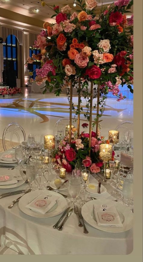 Chandelier With Flowers Wedding, Quinceanera Color Schemes Pink, Flower Centerpieces Quinceanera, Flower Garden Quinceanera Theme, Sunset Quinceanera Theme, Fushia Quinceanera Decorations, Lotus Flower Centerpiece, Flowers Quinceanera Theme, Colorful Quinceanera Theme