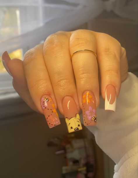 A nude gel-x tapered square nail set with Winnie the Pooh and light spring themed art Cute Winnie The Pooh Nails, Nail Ideas Characters, Whitney The Pooh Nails, Whinney Pooh Nails, Winnie The Pooh Valentines Day Nails, Summer Nails Disney, Artist Nails Design, Pooh Bear Nails Acrylic, Nail Ideas For Disney