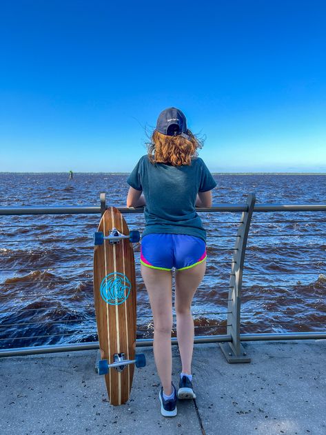 Person Standing Beside the Metal Railing Near Body of Water · Free Stock Photo Person Standing From Behind Reference, Leaning On Railing, Metal Railing, Body References, Metal Railings, Body Of Water, By The Ocean, Person Standing, Body Reference