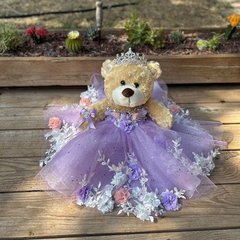 Ideal bear for your quinceanera party, it measures approximately 17" Each dress of our bears is custom designed matching the tone to the color of your quinceanera dress. It is worth mentioning that the tone of the fabric may vary, as well as the accessories (crown, earrings or necklace) If you need a more personalized bear or the same as your dress, it can also be made. Our specialty is satisfying our clients. You can contact us if you require a custom design. Contact: 817-443-7252 FB: Norma Vazquez Fashion Designer https://www.facebook.com/profile.php?id=100077462744454 Quinceanera Doll Light Purple, Quince Doll Purple, Quince Bear, Garden Quince, Quinceanera Bear, Purple Quinceanera, Purple Quince, Quinceanera Pink, Quinceañera Dresses