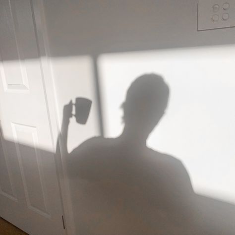 Shadow of girl holding coffee cup cast on a white wall Coffee Shadow Aesthetic, Holding Coffee Aesthetic, Mocha Girl Aesthetic, Sunday Rituals, Coffee Cup Aesthetic, Holding Coffee Cup, Coffee Sunday, Girl Drinking Coffee, Book Coffee Rain Aesthetic