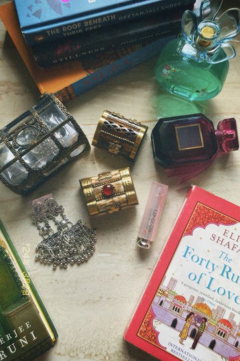 Desi aesthetic. Forty rules of love. Tote bag. Dior. Jhumkas. Desi ig story. Pakistani. Delhi. Silver Jewellery. Wooden boxes. Indian art. Traditional jewellery. Jewellery box. Oxidized jhumke. Palace of illusions. Geetanjali shree. Perfume. Oud. Jasmine. Rumi. Shamz of tabriz book. Poetry. Indian books. Desi vibe. Dilli 6 Forty Rules Of Love Aesthetic, 40 Rules Of Love, Elif Shafak, Forty Rules Of Love, Dazz Cam, Desi Aesthetic, Love Aesthetic, Book Annotation, Lip Glow