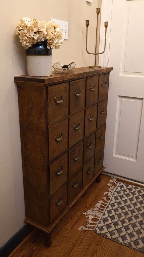 Do you have a small entryway? or do you not want to take up a lot of space in your entryway? This skinny 4 drawer shoe cabinet is perfect for you. It will add a ton of storage without taking up a ton of space. It'll make your entryway cleaner and more inviting. Plus the faux apothecary look will add style to any space. Shoe Storage Cabinet Ideas, Entryway Table And Shoe Storage, Entryway Dresser Ideas, Vintage Shoe Storage Ideas, Boot Room Entrance Hall, Shoe Cabinet Entryway Decor, Small Apothecary Cabinet, Vintage Shoe Rack, Show Cabinet Entryway