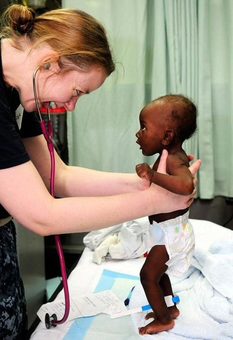 This is a photo of a woman treating a baby in Zambia. This missions group put together health clinics in some villages to test the people for diseases, and to help children become fully healthy. Muzică Rock, Selamat Hari Valentine, Medical Missions, Nurse Aesthetic, Mission Work, Future Jobs, Missions Trip, School Inspiration, School Motivation