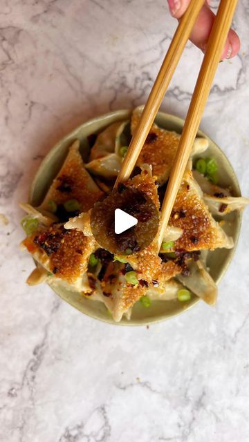 Joely Hiles on Instagram: "I’M A DUMPLING GIRL THROUGH AND THROUGH🥟

Teriyaki Chicken dumplings, makes 16:
INGREDIENTS:
-3 chicken thighs fried in teriyaki then shredded
-4 spring onions
-Large bunch coriander
-1 carrot
-1 tbsp sesame oil
-2 tbsp teriyaki 
-1 tsp mirin
-16 gyoza skins
-2 tbsp sesame seeds
-1 tbsp vegetable oil to fry

METHOD:
-Finely slice spring onion, chop coriander and grate carrot
-Add chicken, veg and seasonings to a bowl and mix until evenly combined 
-Place a tsp of chicken mixture to the centre of a gyoza skin, brush the edges with water and fold as shown
-Dip the base of the gyoza in water followed by sesame seeds
-Heat oil in a frying pan over a medium to high heat and lay on dumplings
-Cook for a about 3 minutes until golden on the base 
-Add in a splash of boi Chicken Dumplings, Chilli Oil, Spring Onions, Teriyaki Chicken, Chicken And Dumplings, Spring Onion, Sesame Oil, Cooking Ideas, Sesame Seeds