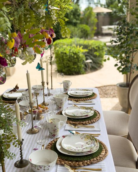 Some snapshots of my Garden Tea Party table, complete with floral dishes, a ruffled white tablecloth, and my favorite table rod adorned with hanging jars of fresh flowers and dancing butterflies 🦋🌸🍃 🦋Comment LINK for a link of items on this table to be sent to your inbox. Or visit the link in my bio. #tablescape #springtablescape #alfrescodining #mikasalifestyle #teaparty #ltkhome Hanging Jars, Dinner Party Table Settings, Tea Party Table, Dinner Party Table, Party Table Settings, Spring Tablescapes, White Table Cloth, Tea Party Garden, Al Fresco Dining