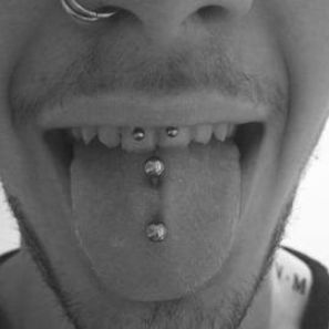 double tongue piercing on men Mens Tongue Piercing, Lip Piercing Men Aesthetic, Men With Tounge Piercings, Tounge Piercing Man, Guy Tongue Piercing, Tongue Piercing Guy, Tongue Piercing Men, Spiderbite Piercings, Guys Ear Piercings