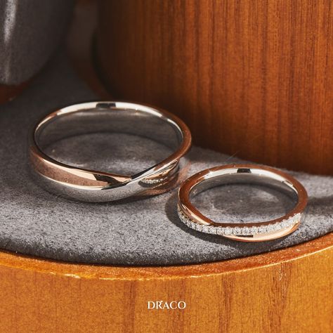 Presenting a timeless and elegant pair of wedding bands that tell a story of love and unity. Our duo-tone rings, expertly crafted in white and rose gold, entwine in a captivating criss-cross design symbolizing the intertwining of two lives. For her, a touch of sparkle and glamour is added with a row of pave diamonds, because who can resist a little extra bling? Wedding Rings Engagement Couple Indian, Couple Rings Wedding Gold Infinity, Rose Gold Couple Rings, Wedding Ring Two Tone, Love Bands Couple Rings, Couple Rings Wedding Gold, Two Tone Wedding Rings, Wedding Ring With Engagement Ring, Simple Gold Wedding Rings