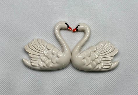 These lovely ceramic swans are hand-made out of high-quality clay, glazed, and fired twice to achieve a shiny luster and durability.  See all photos for size information   They are wonderful additions to your project to give it that extra pop.  Please see other ceramic objects available in my store Pretty Clay Ideas, Swan Gift, Coquette Ceramic Ideas, Animal Pinch Pots Swan, Ceramic Swan, Swan Candle Holder, Swan Ceramic Sculpture, Swan Decor, Thrift Store Diy