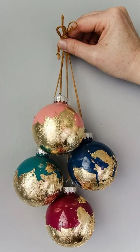 Looking for a way to add a touch of glam to your Christmas decor? You will love these Gold and silver foil holiday crafts! Learn how to make painted ball ornaments dipped in gold foil! #charlestoncrafted #goldfoil #silverfoil #christmas #christmascrafts #christmasornaments #treetopper Christmas Decor Ideas Silver And Gold, Gold Leaf Christmas Ornaments, Painted Ball Ornaments, Kawaii Origami, Making Christmas Ornaments, Gold Foil Diy, Xmas Balls, Leaf Projects, Christmas Beach