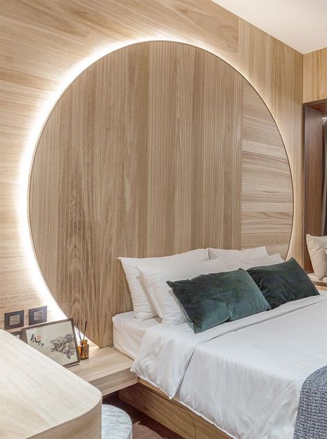 Bedroom Idea - Using natural materials to create a sense of warmth and calm, the design of this circular headboard observes the Chinese concept of “Earth’s a square; heaven a circle”. It also has hidden lighting that creates a soft glow and outlines the design element. #BedroomIdeas #HeadboardIdeas #CircleHeadboard #CircularHeadboard #Lighting Circular Headboard, Hotel Suite Bedroom, Bedroom Paint Colors Master, Hidden Lighting, Feature Wall Bedroom, Modern Apartment Design, Accent Wall Bedroom, Bedroom Headboard, Modern Bedroom Design