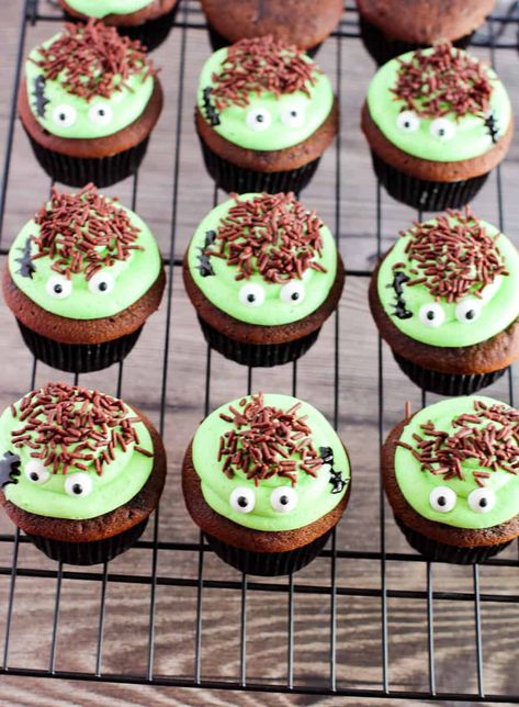 Finished Frankenstein cupcakes on a wire rack. Frankenstein Cupcakes, Cute Halloween Treats, Casserole Side Dishes, Candy Eyeballs, Halloween Baking, Cupcake Pan, Chocolate Sprinkles, Green Food Coloring, Chocolate Cake Mixes