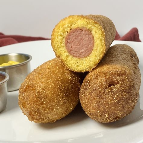 Often enjoyed at fairs, carnivals, amusement parks, and as a convenient meal at home, corn dogs are a popular American food item consisting of a hot dog sausage coated in a thick layer of cornmeal batter and then deep-fried until golden brown. The term "corn dog" typically refers to the entire snack, including the sausage and the batter. They can be served with various condiments such as ketchup, mustard, or even mayonnaise. Hot Dog Sausage, Dog Sausage, Corndog Recipe, Discard Recipe, Sourdough Starter Discard Recipe, Bread Starter, Beef Hot Dogs, Corn Dog, Dough Recipes