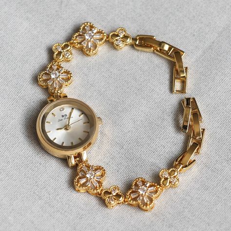 Hey Here is my Dainty Gold Watch For Watch Person Womens Watch Nature Lovers Gift Round Face Watches For Women Gift For Mom Introducing our Clover Vintage Gold/Silver Watch--a timeless blend of elegance and sophistication that goes beyond just keeping time. Perfectly crafted for the woman who values both style and practicality, this exquisite watch is an embodiment of grace and classic beauty. 💕 Key Features: ✨ Elegant Vintage Design: Adorned with a beautifully crafted gold clover dial, this watch adds a refined touch to any ensemble, making it the ideal accessory for elevating your look. ✨ Premium Quality: Made with high-quality stainless steel, this watch promises durability, a luxurious feel, and a polished finish that stands the test of time. ✨ Dependable Functionality: Designed for d Dainty Wrist Watch, Dainty Gold Watch, Gold And Silver Watch, Crocheted Stuff, Watches For Women, Gifts For Nature Lovers, Women Wrist Watch, Lovers Gift, Classic Beauty