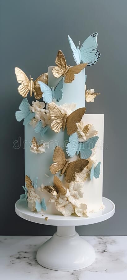 A blue and gold wedding cake with butterflies on the top. royalty free stock photo Blue And Gold Butterfly Cake, Wedding Cake With Butterflies, Blue Butterfly Cake, Blue And Gold Wedding Cake, Cake With Butterflies, Butterfly Quince, Butterfly Wedding Cake, Quince Cakes, Blue And Gold Wedding