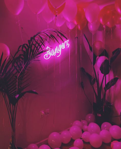 Here is a picture of the backdrop I made for my 21st birthday. It was inspired by Miley Cyrus’s Bangerz album cover. I searched high and low all over the internet (including Pinterest) but couldn’t find anything for a “Bangerz” themed party. The ceiling balloons are pearl magenta and pearl pink. The “21” is rose gold. The palms are from Home Depot/Lowe’s. My girlfriend Monica Chan, brother Jeff Crespin, and myself made the neon “Bangerz” sign. 23 Themed Birthday, Ceiling Balloons, 21st Birthday Themes, 15th Birthday Party Ideas, My 21st Birthday, 21st Bday Ideas, Neon Birthday, Neon Rose, 21st Party