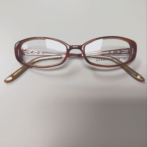 Vintage, Early Y2k Brown, Oval Plastic Eyeglass Frames With Demo Lenses. Metal, Detailed Cut Out Pattern On Temples With Brown, Plastic Temple Covers. Small Flaw In Demo Lens, But The Lenses Are Not Me At To Be Used For Wear. These Are Smaller Style Frame, Very Typical Of The Style Of The Early 2000s. New, Old Stock. Nostalgic Y2k Fashion. 2000s Genre. L227 Model Sk4 Color Brown Eye Width 50mm Eye Height 27mm Bridge 18mm Temple Length 135mm Funky Eyeglasses For Women, Early 2000s Glasses, 90s Glasses Frames, Trendy Glasses Frames 2024, Browline Glasses Women, Rectangle Glasses Woman, Y2k Eyeglasses, Vintage Glasses Aesthetic, Cute Eye Glasses