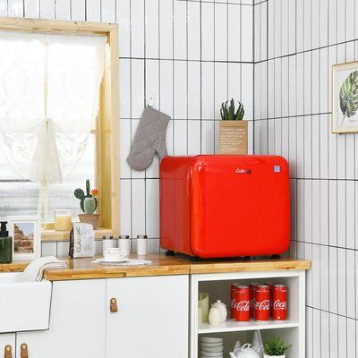 Our compact refrigerator is a perfect choice for your home, office, or any place! With our mini-fridge, you can keep your favorite beverages cool while taking up minimal space and consuming low energy. Equipped with a high-quality compressor and advanced sealing technology, this refrigerator can achieve rapid cooling from 32°F to 50°F. And you can adjust the temperature by turning the built-in temperature control knob to 7 levels. Besides, the fridge is equipped with an automatic defrost functio Mini Fridge Stand, Compact Fridge, Compact Refrigerator, Minimal Space, Small Home Office, Bottle Rack, Tiny Kitchen, Mini Fridge, Refrigerator Freezer