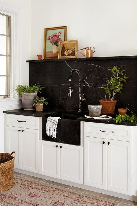 An antique beige and red runner sits in front of white mudroom cabinets adorned with oil rubbed bronze hardware and a honed black marble countertop. Black Marble Backsplash, White Marble Tile Backsplash, Black Marble Countertops, Black Kitchen Countertops, Marble Tile Backsplash, Marble Backsplash Kitchen, Mudroom Cabinets, Black Backsplash, Best Kitchen Design