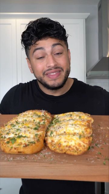 Ahmad Alzahabi on Instagram: "Garlic Cheesy Bread 😈 1 large French loaf 1 stick butter 1-2 Tbsp hot pepper pasta 2 Tbsp chopped cilantro or parsley 5-10 cloves of garlic (1 tsp salt) 1.5 cup mozzarella 1 cup sharp cheddar Finish with Parmesan cheese and parsley/cilantro #cheesebread #food #recipe #garlicbread" Cheesy Garlic Bread Scrolls, Tortilla Cheesy Garlic Bread, Cheesy Garlic Herb Bread, Ahmad Alzahabi, Garlic Cheesy Bread, 40 Clove Garlic Bread, Jack Astors Garlic Pan Bread Recipe, French Loaf, Garlic Cheddar