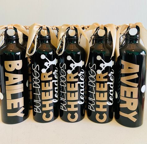 **Only available for orders over 10 quantity at $18.00 each.** If you would like more than 30 bottles, please message me so that I can create a listing for you. As some of my BEST SELLERS, the team water bottles are the perfect gift for your team! In an effort to get your bottles processed and shipped without delay, please include the following in the personalization box: 1. TEAM NAME (as you want it on bottle) 2. Team colors (1-2 colors) using the color chart 3. Cheerleader/player names The Alu Cheerleader Water Bottle Ideas, Cheer Water Bottles Ideas, Cheer Water Bottles, Gifts For Cheerleaders, Team Water Bottles, Cheer Team Gifts, Cheer Stuff, Cheerleading Gifts, Aluminum Water Bottles