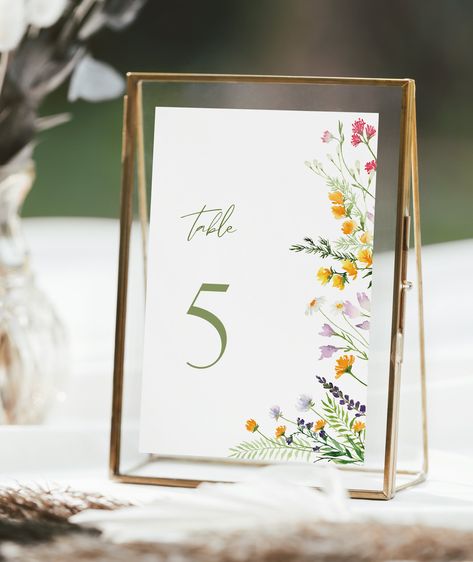 Spring is in the air! Gorgeous wildflowers are a great addition to your table decor. #wedding #dinner #tabledecor #wildflowers #etsyshop Wild Flower Wedding Theme Table Decor, Boho Wildflower Wedding Decor, Boho Garden Party Wedding, Wildflower Wedding Table Numbers, Wild Flower Wedding Theme Ceremony Decor, Cottage Garden Wedding Theme, Spring Table Decor Wedding, Wedding Table Numbers Floral, Colorful Table Numbers Wedding