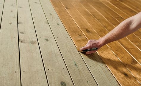 A person waterproofing a deck with a tinted exterior wood sealer. Staining Treated Wood, Deck Plans Diy, Deck Sealant, Porch And Patio Paint, Outdoor Wood Decking, Deck Stain And Sealer, Outdoor Wood Stain, Wood Deck Stain, Treated Wood Deck