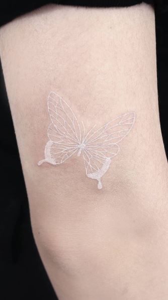 <<Check out more white ink tattoos #tattoomenow #tattooideas #tattoodesigns #tattoos #white #whiteink #butterfly White Tattoos Aesthetic, White Wings Tattoo, Aesthetic White Tattoo, White Tatoos Aesthetic, 3 White Butterflies Tattoo, White Tattoo Aesthetic, Tattoo Ideas White Ink, White Ink Tattoo Butterfly, Tattoos With White Ink