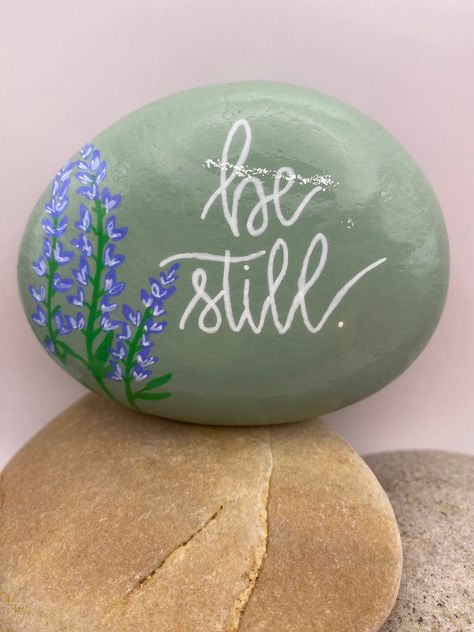 This hand-painted rock is a one-of-a-kind work of art. I use acrylic paint and all lettering and graphics are free-hand. The rock is protected with a sealant to make it suitable for indoor and outdoor purposes. Painted Rocks With Words, In Memory Painted Rocks, Rock Painting Ideas Quotes, Plant Rock Painting, Bible Verse Rock Painting, Worry Rocks, Christian Rock Painting Ideas, Hand Painted Rocks Ideas, Rock Bible Verse