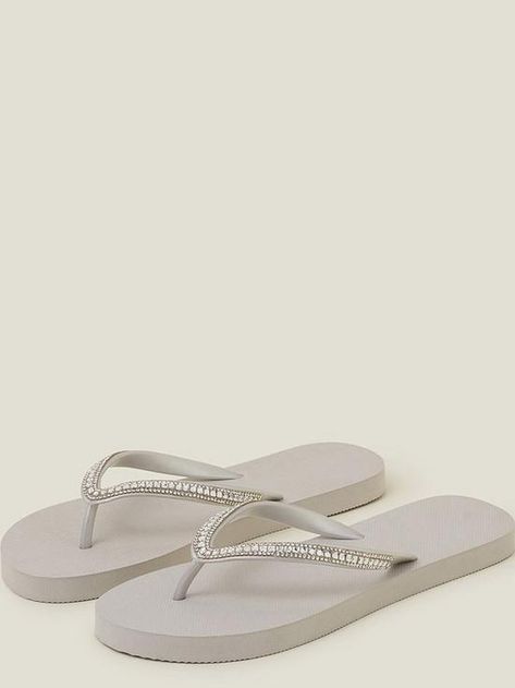 Accessorize Silver Emb Eva Flip Flop Sun, sea and sparkly flip flops. Slip into this pair for holiday strolls, featuring a platform sole and embellished toe-post strap. Material Content: Upper: Copper Coated Beads 50%, Polyvinylchloride (pvc) 50% • Outer: Ethylene Vinyl Acetate 100% • Lining: Polyvinylchloride (pvc) 100% • Sole: Sparkly Flip Flops, Flip Flop, Flip Flops, Copper, Sun, Vinyl, Beads, Silver