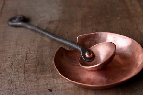 "Save yourself the mess with this functional and beautiful Copper Spoon Rest, the perfect piece to compliment your Wicks Forge Coffee Scoop or Copper and Steel Ladle. The Spoon Rest is hand-formed from a sheet of copper into a resting cup shape. It measures approximately 3 ¾\" in diameter and has a small divot to stabilize the handle of your cooking utensil." Copper Cooking Utensils, Copper Spoon, Copper Work, Copper Utensils, Copper Crafts, Blacksmith Projects, Cooking Utensil, Copper Bowl, Coffee Scoop