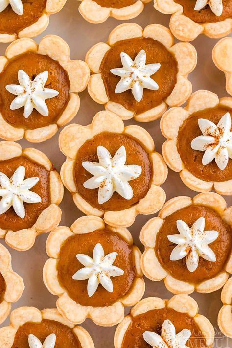 These Mini Pumpkin Pies capture all of the warm, comforting flavors of a traditional pumpkin pie but in a fun, bite-sized version. With a buttery, flaky crust and a rich, spiced pumpkin filling, theses adorable mini pumpkin pies are sure to be a hit at holiday parties, family gatherings, or a cozy dinner with friends! | MomOnTimeout.com Cupcake Pan Pies, Vegan Pot Pie Recipe, Mini Pumpkin Pies Recipe, Mini Cherry Pies, Classic Pumpkin Pie, Mini Sweets, Vegan Pot Pies, Mini Pumpkin Cheesecake, Pumpkin Whoopie Pies