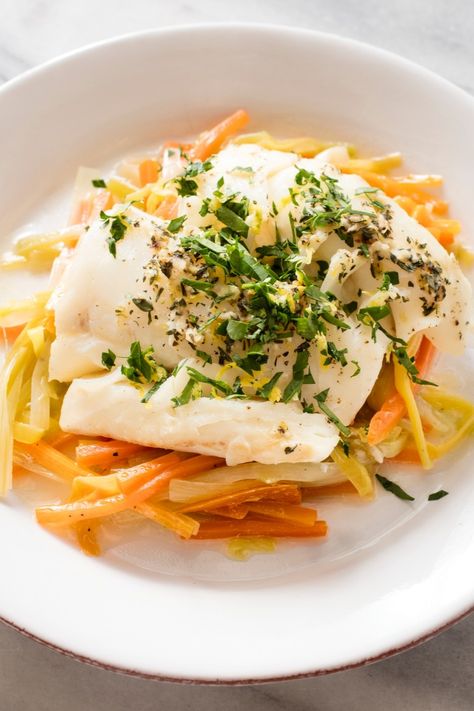 Cod Baked in Foil with Leeks and Carrots: As the holiday season approaches, have an easy, healthy meal on deck. Baking fish in foil helps to keep it extra moist, while cooking your vegetables at the same time. Paleo Cod, Cod Baked, Steamed Cod, Test Kitchen Recipes, America's Test Kitchen Recipes, America's Test Kitchen, Cooks Illustrated, Garlic Recipes, Baked Fish