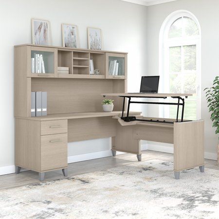 The Bush Furniture Somerset 72W 3 Position Sit to Stand L Shaped Desk with Hutch offers an ideal solution for those seeking a stylish and functional ergonomic workspace. As a quality alternative to desktop risers, the innovative 42W x 24D Sit to Stand Return offers all the health benefits of a standing desk with the versatility of more expensive electric height adjustable options. The built-in mechanical Lift-n-Lock system allows the desktop to lock into place at standing heights of 35, 38, and L Shaped Desk With Hutch, Desk With Hutch, Frosted Glass Door, Desk Hutch, Sit To Stand, Office Set, Bush Furniture, L Shaped Desk, Office Furniture Desk