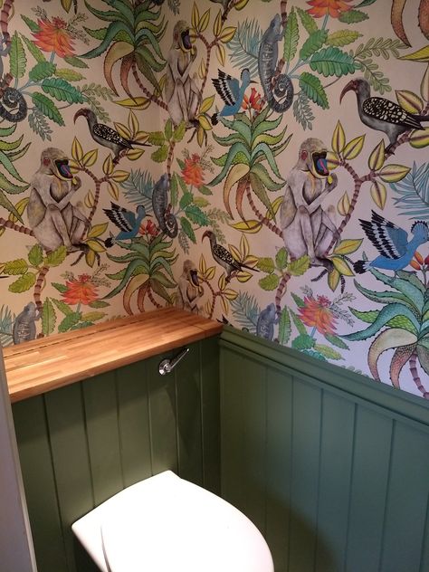 Bold Small Toilet Ideas, Cloakroom Toilet Wallpaper, Tropical Toilet, Savuti Wallpaper, Tropical Toilets, Quirky Toilet, Green Panelling, Tiny Wet Room, Understairs Toilet