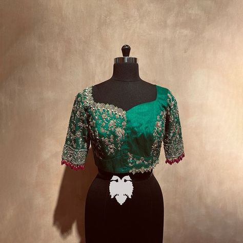 BlouseHousebyMahithaPrasad on Instagram: "Add a Touch of Luxury with this Emerald Green Zardosi Blouse Elevate your style with this stunning emerald green raw silk blouse, featuring intricate zardosi embroidery that makes it a truly unique piece. With a jewelled neckline and beautiful floral creepers adorning the body and sleeves, this blouse is perfect for any special occasion. Zardosi embroidery is a highly intricate and time-consuming craft that adds a touch of luxury and sophistication to a Green Blouse Embroidery Designs Silk, Zardosi Blouse, Zardosi Work Blouse, Saree Inspiration, Indian Wardrobe, Pink Blouse Designs, Raw Silk Blouse, Zardosi Embroidery, Bridal Blouses