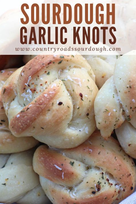 These Fluffy Buttery Sourdough Garlic Knots are the perfect addition to pizza night, game day, or any holiday gathering! Made with an active sourdough starter and no yeast, they’re naturally leavened and ready in just one day. Each knot is brushed with garlic butter, sprinkled with parmesan cheese, and baked to perfection. Whether you're serving them as an appetizer or side, these cheesy, homemade garlic knots will impress everyone at the table! Sourdough Garlic Knots Easy, Sour Dough Rolls Using Starter, Garlic Sourdough Bread Recipe, Active Sourdough Starter Recipes Quick, Sourdough Party Food, Sourdough Garlic Rolls, Sourdough Discard Garlic Knots, Sourdough Snacks For Kids, Discarded Sourdough Starter Recipes