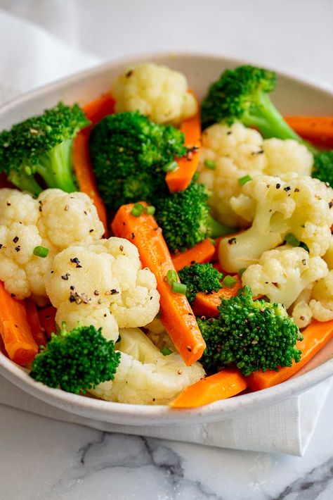 A simple dish of Buttered Vegetables can add color, nutrients, and freshness to a dinner. It may be a simple side dish, but adding veggies to a meal doesn't have to be complicated, and let's face it, some nights, it just needs to be easy! We all know vegetables are good for us, and by adding butter to them, we can create a simple, delicious dish that is perfect served with any meal! Boiled Vegetables Recipe, Steam Vegetables Recipes, Broccoli Cauliflower Recipes, Mix Vegetable Recipe, Roasted Carrot Soup, Buttered Vegetables, Roasted Carrot, Boiled Vegetables, Carrots Recipe