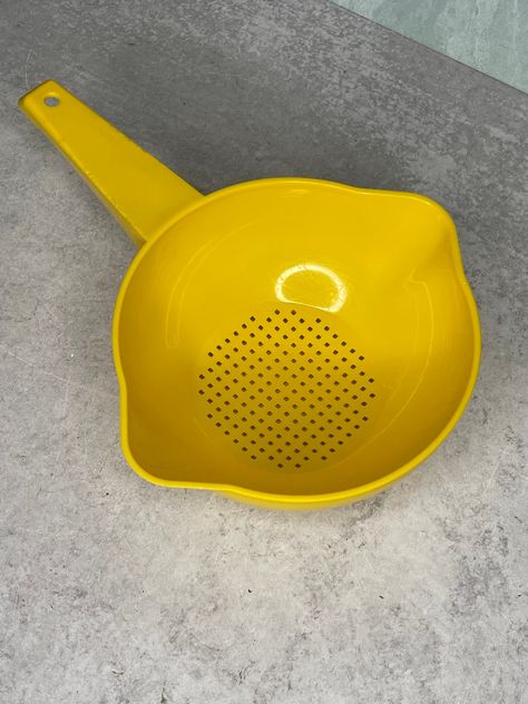 Nice two quart yellow strainer by Tupperware number 1523.  This has light use overall and a nice usable item.  Comes from a smoke and pet free home. THE TUPPERWARE I SELL IS VINTAGE AND MAY HAVE MINOR USE OR STORAGE MARKS. I DO MY BEST TO MENTION ANY CONDITION ISSUES OR DAMAGE IF THERE IS ANY IN EACH LISTING. I DO CLEAN MY TUPPERWARE BEFORE SHIPPING HOWEVER I WOULD SUGGEST CLEANING IT AGAIN. Family Heirloom Display, Antique Hand Tools, I Love You Mother, Nice One, Vintage Memory, Vintage Cups, Vintage Kitchenware, Vintage Tupperware, Vintage Dishes