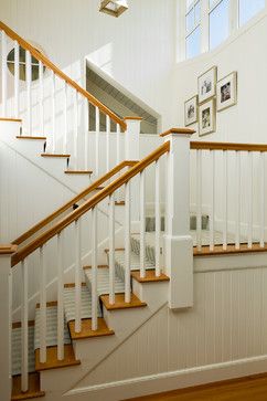 Simple white square balusters with natural wood railing Round Stairs Design, Basement Stairway Ideas, Basement Stairway, Basement Stairs Ideas, Round Stairs, Cape Style Homes, Open Stairs, Stair Makeover, Contemporary Staircase