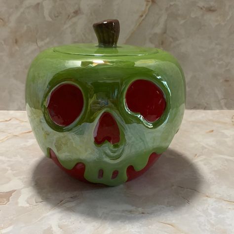 Disney: Snow White Poison Apple Cookie Jar From The Villains Division. This Is A Beautiful Ceramic Cookie Jar With A Iridescent Green Glaze With A Red Background Shape Like A Apple With A Wicked Face . Measurements: Circumference 22 1/2”, 6” High , 6 “ Across, 5” Depth. Sorry Due To Weight Of Product This Can’t Be Bundled. Disney Clay Art, Nonfunctional Ceramics, Marvel Ceramics Ideas, Ceramic Christmas Gifts, Disney Clay Ideas, Poison Apple Pumpkin Painting, Food Sculpture Clay, Pottery Cookie Jar, Disney Ceramics Ideas