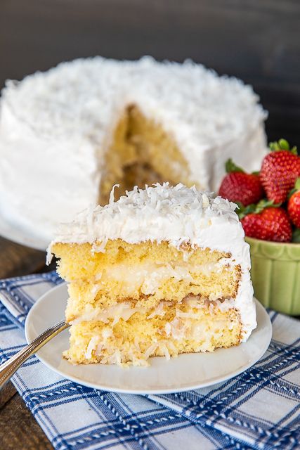 Coconut Cake - the sour cream cool whip frosting makes this cake! It is AMAZING!!! So easy to make and everyone loves it! This is my go-to cake for holidays and parties. Everyone always asks for the recipe! Only 5 ingredients -Cake mix, sour cream, cool whip, coconut and sugar. The frosting has to sit overnight in the refrigerator, so plan ahead to make this easy Coconut Cake! #cake #coconutcake #dessert #recipe Icing With Cool Whip, Coconut Cake Icing, Coconut Cake Frosting, Cake Recipe With Sour Cream, Sour Cream Coconut Cake, Sour Cream Icing, Cake With Sour Cream, Whip Frosting, Cool Whip Frosting