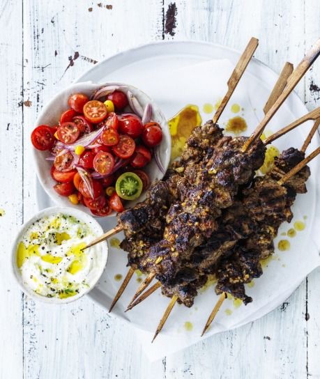 Neil Perry's spicy lamb skewers with cucumber yoghurt Recipe | Good Food Cumin Lamb, Yoghurt Recipe, Grilled Flatbread, Neil Perry, Lamb Skewers, Perfect Picnic, Ripe Tomatoes, Lamb Recipes, Break Out