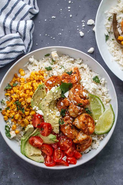 Loaded Shrimp Rice Bowl recipe. Fluffy white rice topped with seasoned juicy shrimp, avocado slices and corn with a cilantro lime sauce. Shrimp Rice Bowl Recipe, Shrimp Rice Bowl, Rice Bowl Recipe, Shrimp Rice, Chicken Rice Recipes, Plats Healthy, Juicy Shrimp, Shrimp Recipes Healthy, Shrimp Avocado