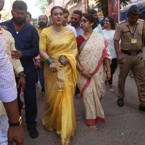 kajol in a yellow raw mango saree for lalbaug visit Raw Mango Sarees, Yellow Silk Saree, Raw Mango, Chanderi Silk Saree, Latest Designer Sarees, Nude Lips, Glass Bangles, White Saree, Yellow Saree