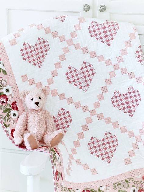 Hearts Delight Quilt Pattern PAPER Copy. This delightful quilt is all about cozy comfort and timeless charm. Our Hearts Delight Quilt Pattern is perfect for creating a beautiful baby quilt, crib quilt or bed quilt that will be cherished for years to come. 4 sizes included. With the timeless beauty of a classic Irish chain, sweet hearts are nestled within for a wonderful vintage look that's mixed with modern flair. Perfect for nurseries, baby showers, or as a thoughtful gift for new parents, the Hearts Delight Quilt Pattern is sure to become a treasured heirloom. Shown here in pinks, this would also be darling in blues, or whatever color combination you like. Make one of the larger sizes for a toddler quilt, or a beautiful bed quilt for a charming farmhouse look. Simply pick 3 fabrics plus Crib Quilts, Charm Pack Quilt Patterns, Bed Quilts, Charm Pack Quilt, Heart Quilt Pattern, Baby Quilt Pattern, Quilt Square, Bed Quilt, Sweet Hearts