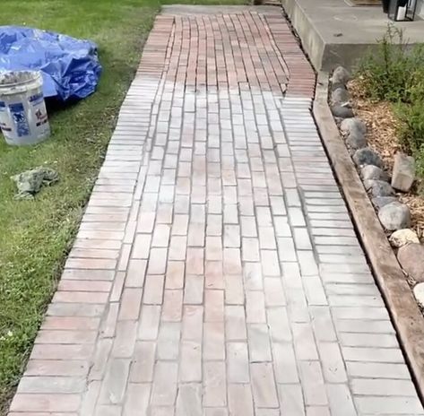 I wanted to add some curb appeal to our front steps, so I added some brick pavers over my existing concrete pathway...yes, that's right...OVER the existing sidewalk. Here is what our walkway looked like before...boring beat up concrete. First, I roughly laid out the brick pattern I would use. Then I mixed grout up in a bucket. Make sure to use exterior grade grout. Then I started to lay the grout with a thinly notched trowel. Then I put a small amount of grout on each brick and… Brick Pavers Over Concrete Sidewalk, Brick Concrete Walkway, Brick Paver Walkways To Front Door, Brick Paver Sidewalk, Brick Sidewalk Ideas, Pavers Over Concrete Walkway, Brick Sidewalk Front Walkway, Brick Overlay On Concrete, Paver Walkways To Front Door