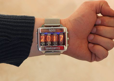 We've seen Nixie-tube-based clocks before, but Italy-based Igor Gudiy has taken them to another level. Under the shop name NixieHorizonte, Gudiy is selling Nixie-tube wristwatches of his own design on Etsy: The watch can display the time in either 12- or 24-hour format, as well as the date and even Nixie Tube Watch, Latest Technology Gadgets, Nixie Tube, Steampunk Clock, Watch Clock, White Clocks, Amazing Watches, Punk Vintage, Expensive Watches